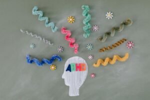 Creative illustration highlighting ADHD awareness with colorful brain imagery.